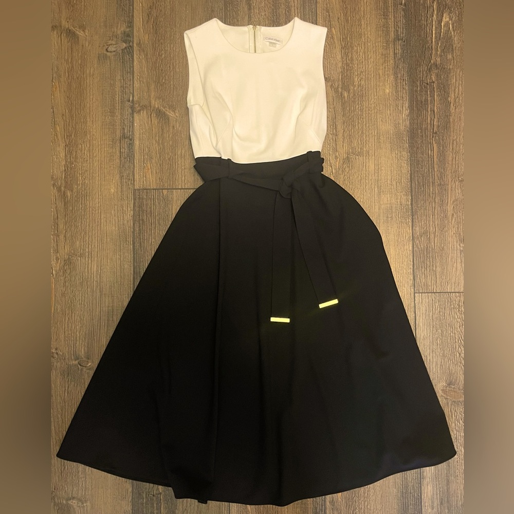 Calvin Klein black and white dress size 8 with gold tipped belt.
